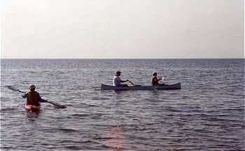 Dinesh in his kayak and Steve and Jerry in their canoe